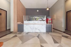 a large kitchen with a marble counter top at Sans Vibes Hotel Malabar in Bandung