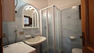 a bathroom with a sink and a shower at Le Perce Neige in Morgex +14 photos