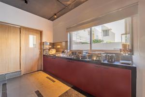a kitchen with a counter with pots and pans at Treebo Premium Corner Stay in Coimbatore