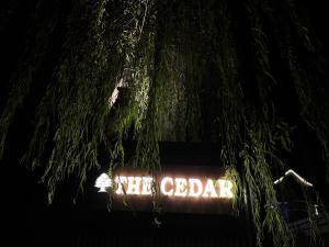 a neon sign that says the adldahl at night at The Cedar Pahalgam in Pahalgām