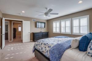a bedroom with a bed and a ceiling fan at Beautiful Backyard Oasis 5 bedroom 3 Bathroom Home in Placentia +37 photos