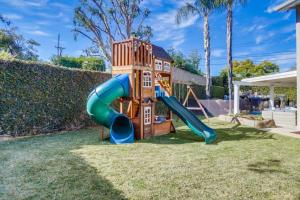 a playground with a slide in a yard at Beautiful Backyard Oasis 5 bedroom 3 Bathroom Home in Placentia