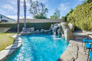 a pool in a backyard with a water slide at Beautiful Backyard Oasis 5 bedroom 3 Bathroom Home in Placentia