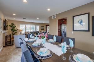 a dining room and living room with a table and chairs at Beautiful Backyard Oasis 5 bedroom 3 Bathroom Home in Placentia