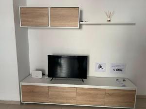 a flat screen tv sitting on top of a cabinet at Stunning apartment in Oropesa del Mar in Oropesa del Mar