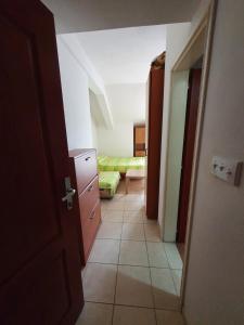 a hallway with a room with a bed and a door at Vukovic View Apartment in Topla