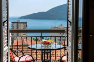 a bowl of fruit on a table on a balcony at Vukovic View Apartment in Topla