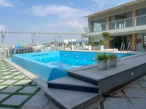 a swimming pool on the roof of a building at Hotel Narenn HITEC CITY in Hyderabad