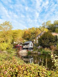a group of houses on the side of a river at The Gentle Stay in Brunoy