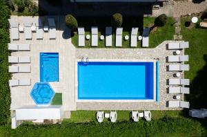 an overhead view of a swimming pool in a resort at Bile - Family Hotel & Gastro Bar in Beli Osŭm