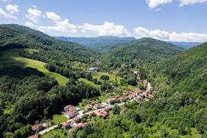 an aerial view of a village in the mountains at Bile - Family Hotel & Gastro Bar in Beli Osŭm