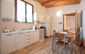 a kitchen with a table and a dining room at Umbria Montefranco in Montefranco