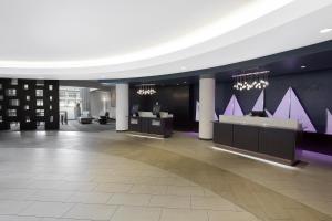 a lobby with purple walls and a reception desk at Hyatt Regency Baltimore in Baltimore
