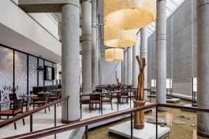 a restaurant with tables and chairs in a building at Hyatt Regency Baltimore in Baltimore