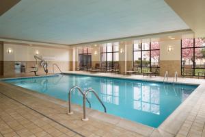 a large swimming pool in a hotel room with a large swimming pool at Hampton Inn & Suites Chadds Ford in Glen Mills