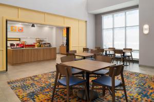 a classroom with tables and chairs in a cafeteria at Hampton Inn & Suites Chadds Ford in Glen Mills