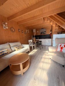 a living room with a couch and a table at Baltic Star in Władysławowo