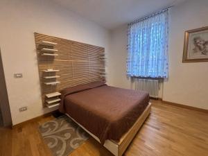 a bedroom with a bed in a room with a window at Casa Mane in Avezzano