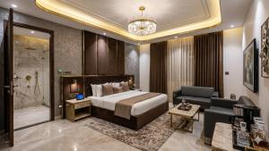 a hotel room with a bed and a bathroom at Hotel Preeti Residency Delhi in New Delhi