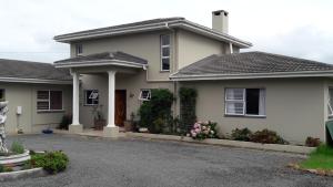 a house with a driveway in front of it at Terryton Country Estate in Gonubie
