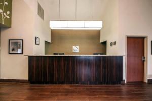a lobby with a reception desk in a building at Sleep Inn & Suites Tulsa Central I-44 in Tulsa +45 photos