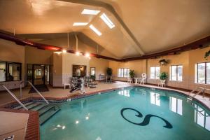 a large swimming pool in a hotel room at Sleep Inn & Suites Tulsa Central I-44 in Tulsa