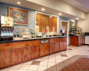 a kitchen with a counter with alot of food at Quality Inn & Suites Clinton - Jackson West in Clinton