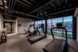 a gym with two tread machines and a large window at Comfort Inn Hermosillo Pitic in Hermosillo