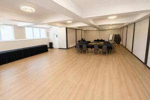 a large room with a table and chairs in it at Maritime Inn Port Hawkesbury in Port Hawkesbury +46 photos