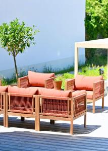 a group of wicker chairs sitting on a patio at Architect-Designed Villa with Heated Indoor Pool in Oslip