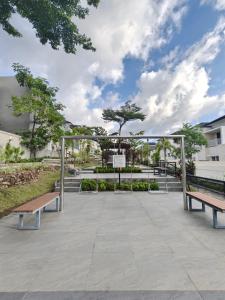 a group of benches in a park at Prosperity House Southlinks in Bagam