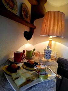 a tray of food on a table with a plate of food at il Bucaneve in Norcen