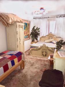 a bedroom with two twin beds and a window at Квартира 89 in Bishkek