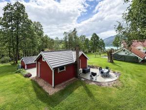 an overhead view of a red shed in a yard at 4 person holiday home in OMASTRAND-By Traum in Sanddal