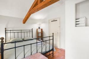 a bedroom with a bed in a room at La Villa Andéria in Callian
