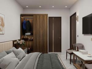 a bedroom with a large bed and a living room at Olivia Hotel in Ấp Thành