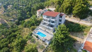 an aerial view of a house with a swimming pool at Villa Stanić in Omiš