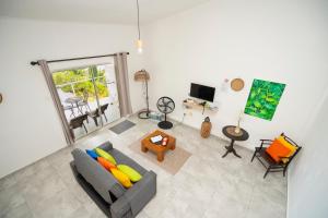 an overhead view of a living room with a couch at Wild Vanilla Apartment in Beau Vallon