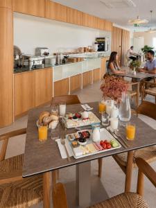a table with plates of food on it in a kitchen at Arkk Rooms in Antalya