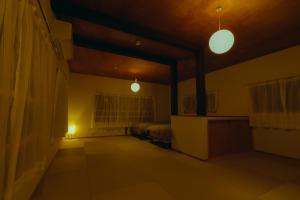 a room with two lights and a bed in it at 浬-kairi-1852 in Choshi