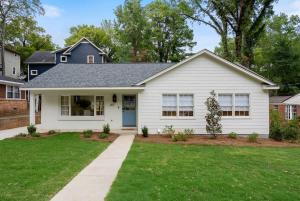 a white house with a blue door at Family Friendly 4BR Oxford Home Near The Square in Oxford