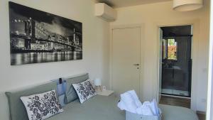 a living room with a couch and a picture on the wall at Bobbio Relax in Bobbio