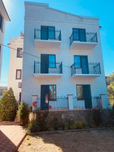 a building with balconies on the side of it at Avrora L in Zatoka