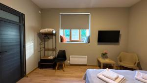 a bedroom with a bed and a window at Ararat Terrace House in Ashtarak