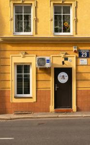 a building with a door with a sign on it at Przystanek Wałbrzych in Wałbrzych
