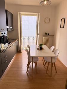 a kitchen and dining room with a table and chairs at Casa Mate in Bra +2 photos