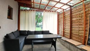 a living room with a couch and a table at Tiny House Krumlov, Terrace, Parking in Český Krumlov