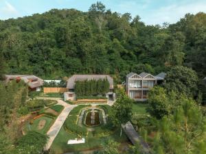 an aerial view of a house with a garden at Flora Creek Chiang Mai in Hang Dong