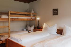 two beds in a room with two bunk beds at City Bungalow in Schladming +30 photos