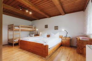 a bedroom with a bed and a bunk bed at City Bungalow in Schladming